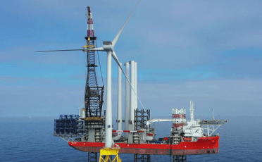 Offshore wind turbine being installed using giant crane